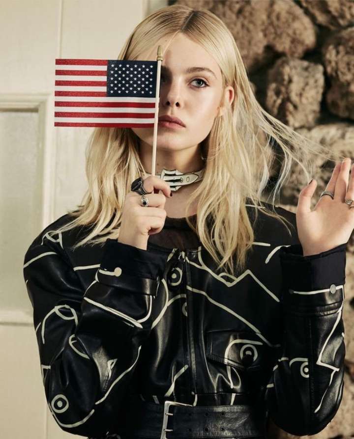 The Elle holding USA Flag